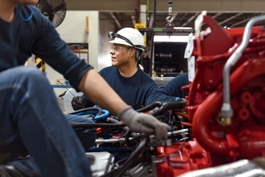 A group of people working on a machine
